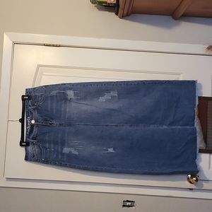 Distressed  denim maxi skirt. Never worn. With tags